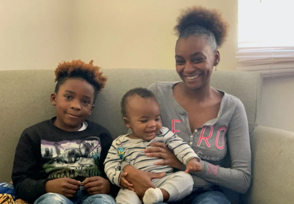 single-mother-and-2-kids-on-couch-935x